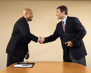 Businessmen Handshake During Interview | Shutterstock.com