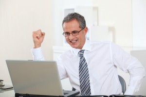 Seasoned Businessman on Laptop